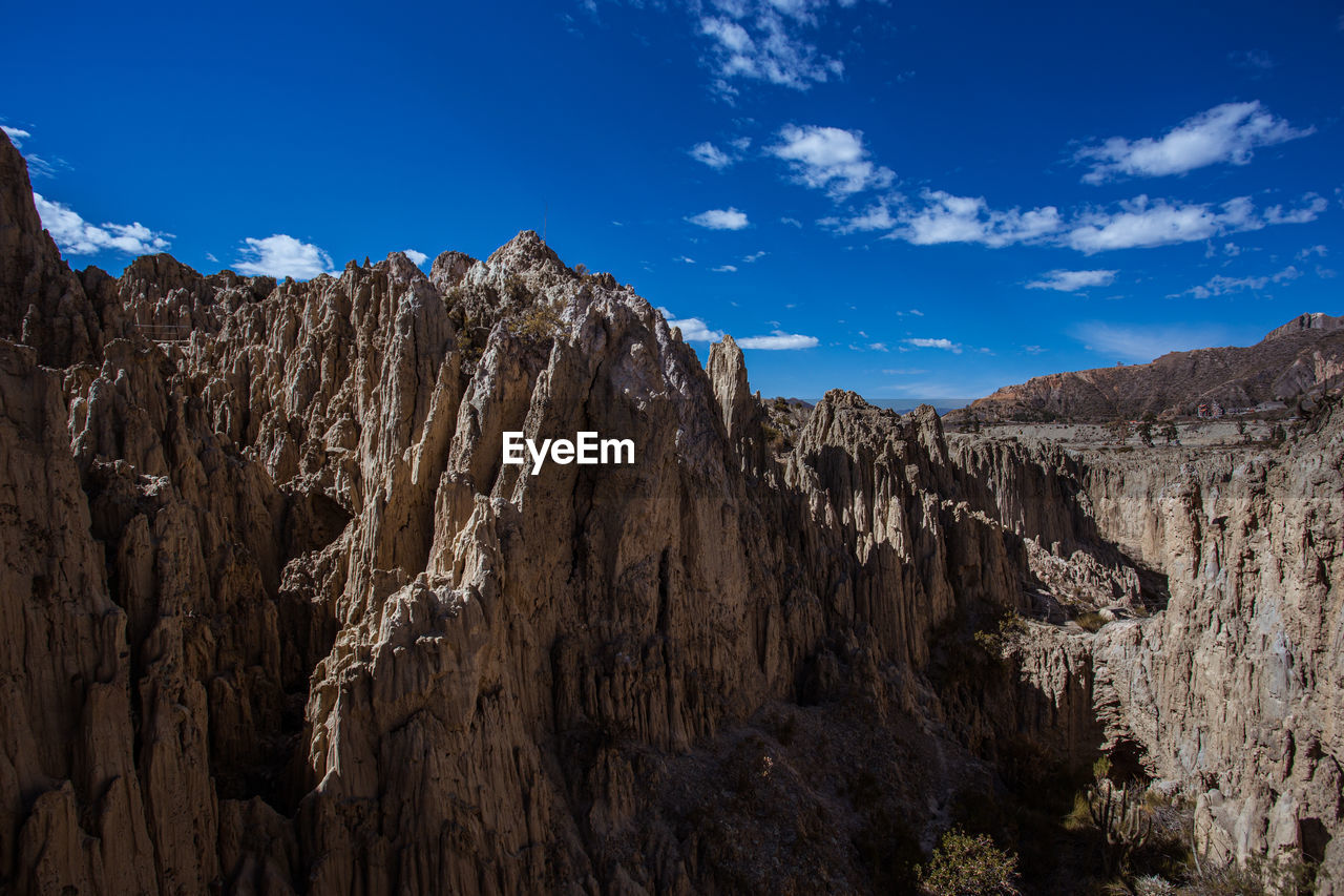 Panoramic view of rock formations against sky