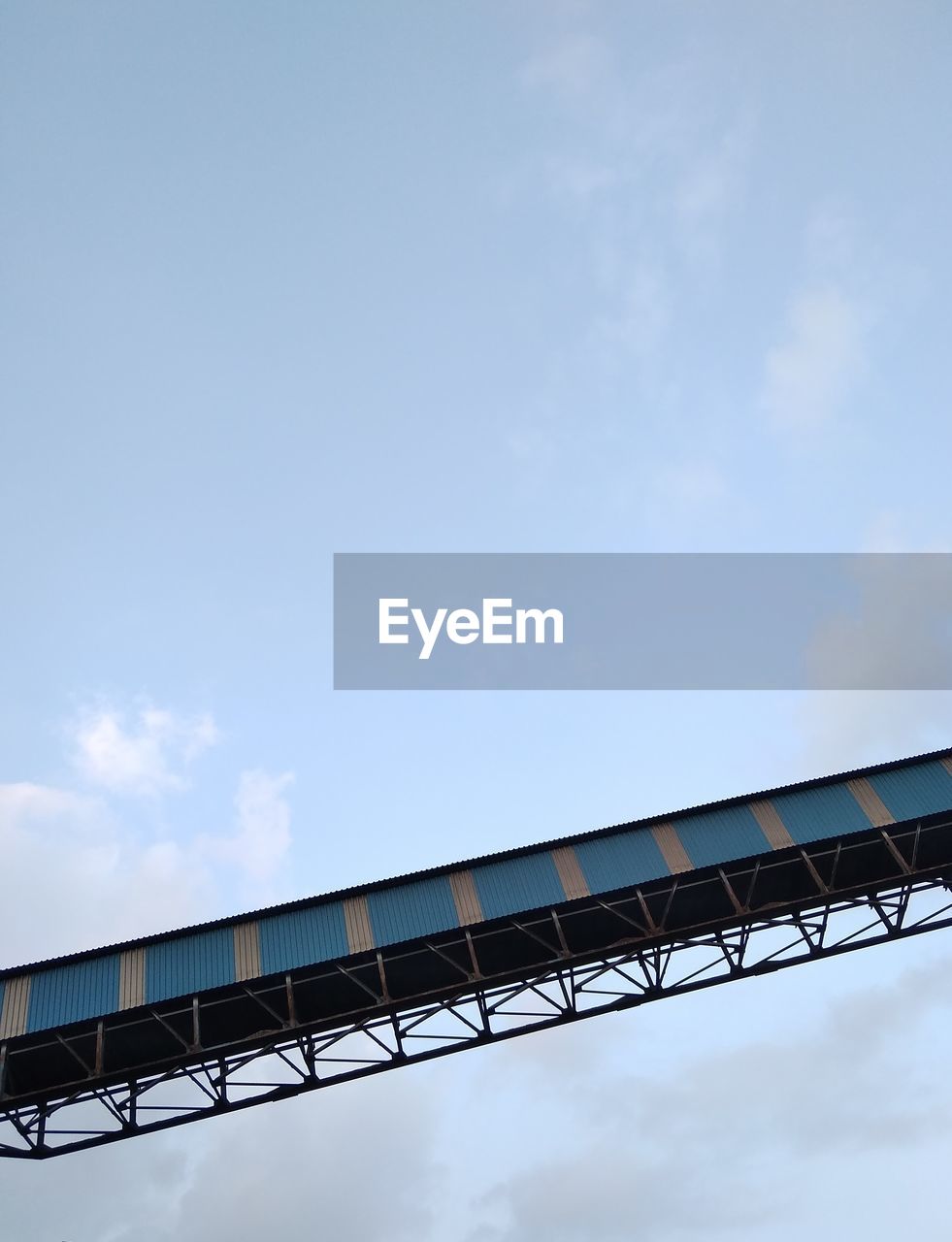 LOW ANGLE VIEW OF BRIDGE AGAINST BLUE SKY