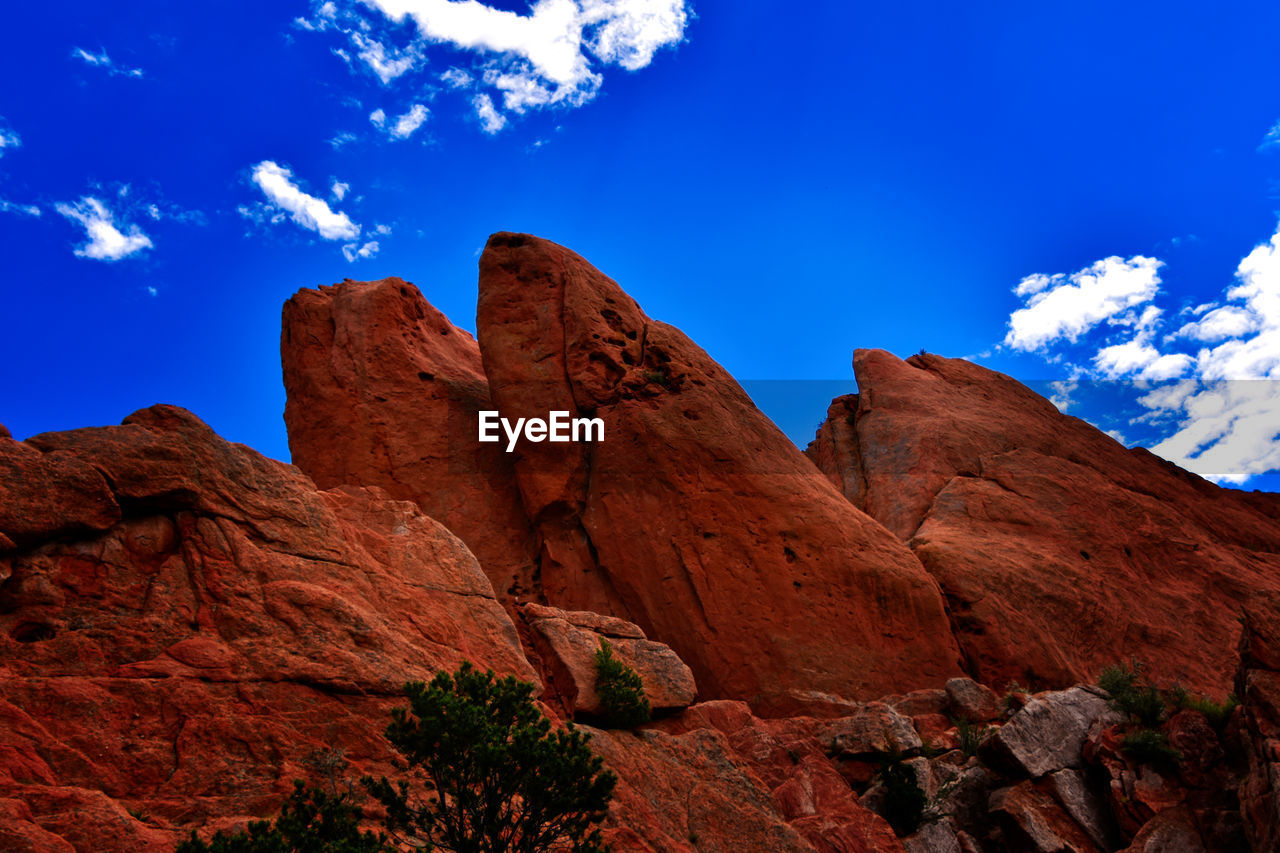 Low angle view of rock formations against sky