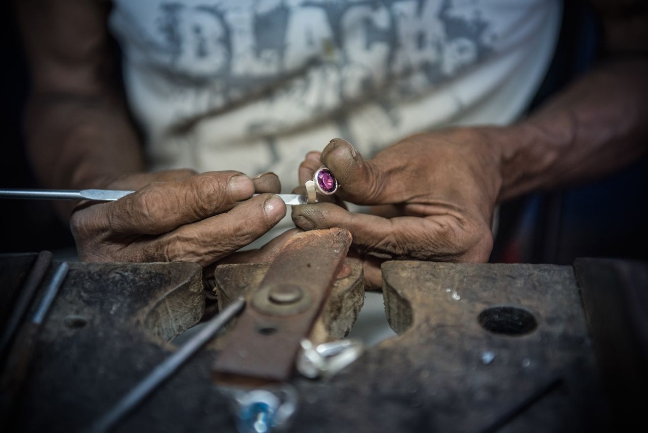 Midsection of man working in workshop