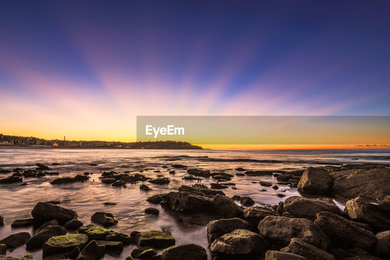 Scenic view of sea against sky during sunset