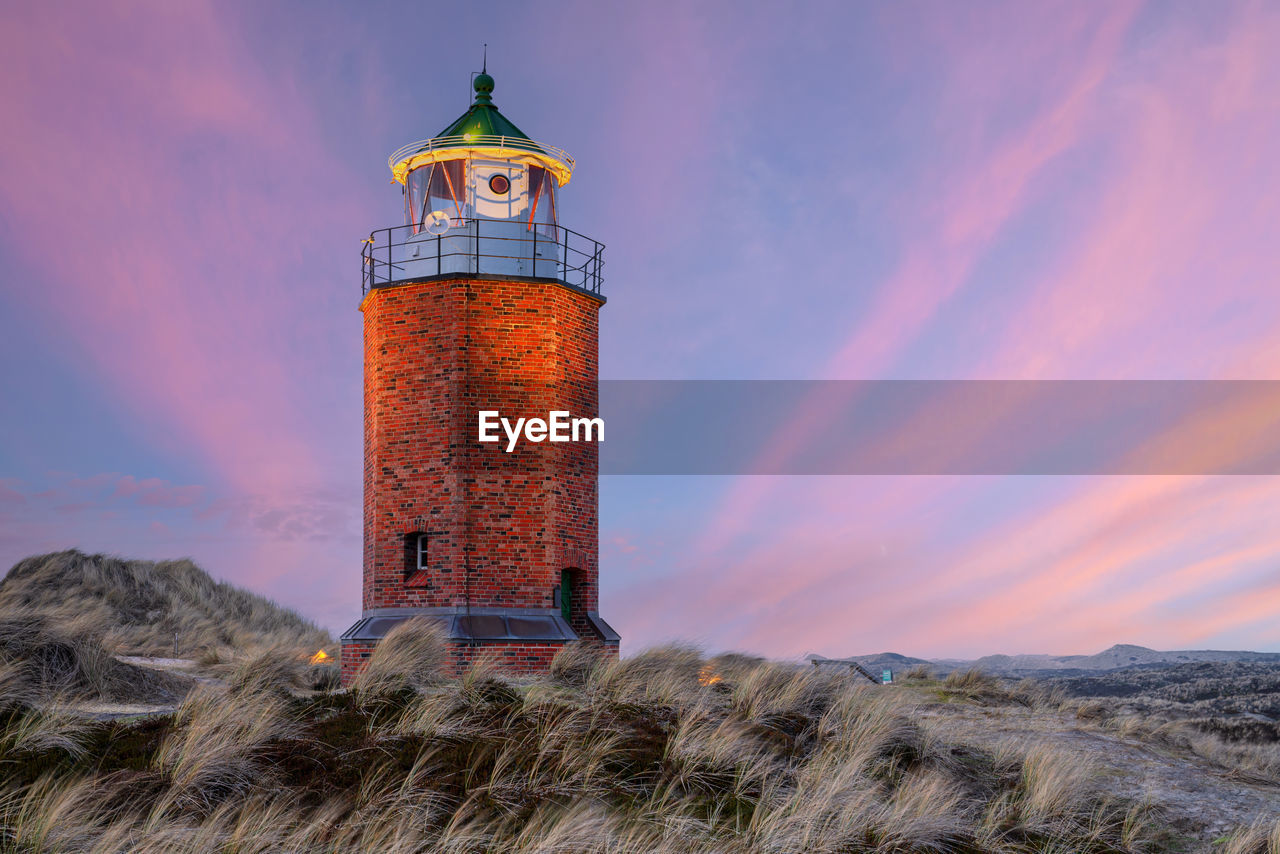 tower, lighthouse, architecture, sky, built structure, building exterior, nature, guidance, sunset, land, building, cloud, landscape, security, protection, environment, sea, no people, history, travel destinations, outdoors, scenics - nature, the past, travel, beach, dusk, water, beauty in nature