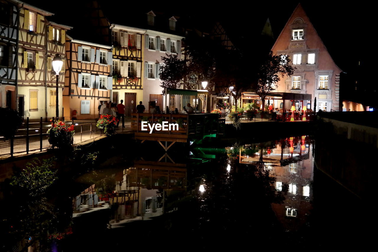 VIEW OF ILLUMINATED TOWN AT NIGHT