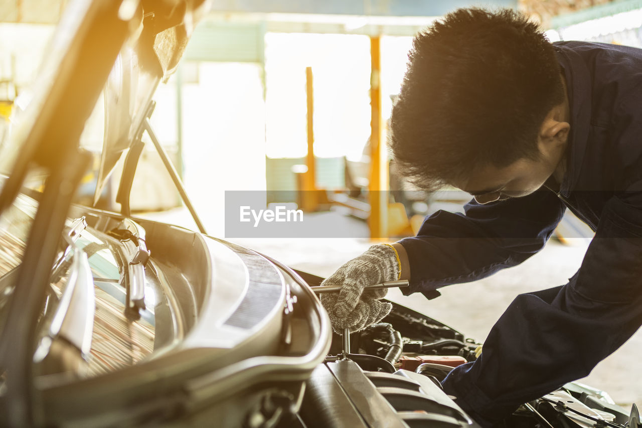 Mechanic repairing car at auto repair shop