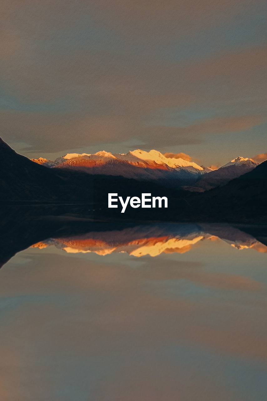 Scenic view of mountains against sky during sunset