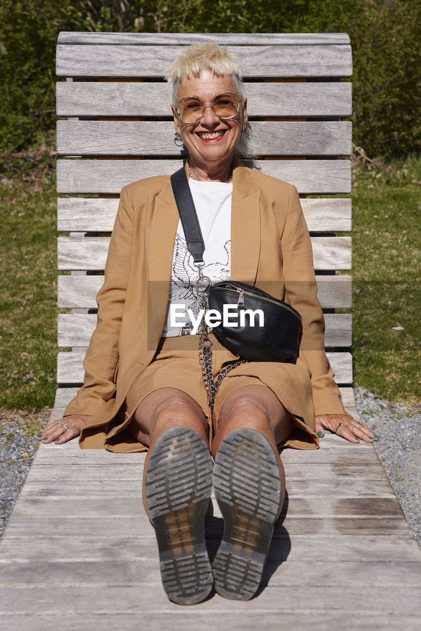 Mature woman relaxing on sun lounger