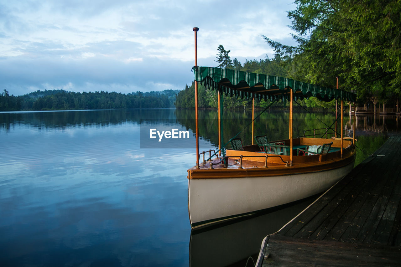 Boat moored on upper st regis lake