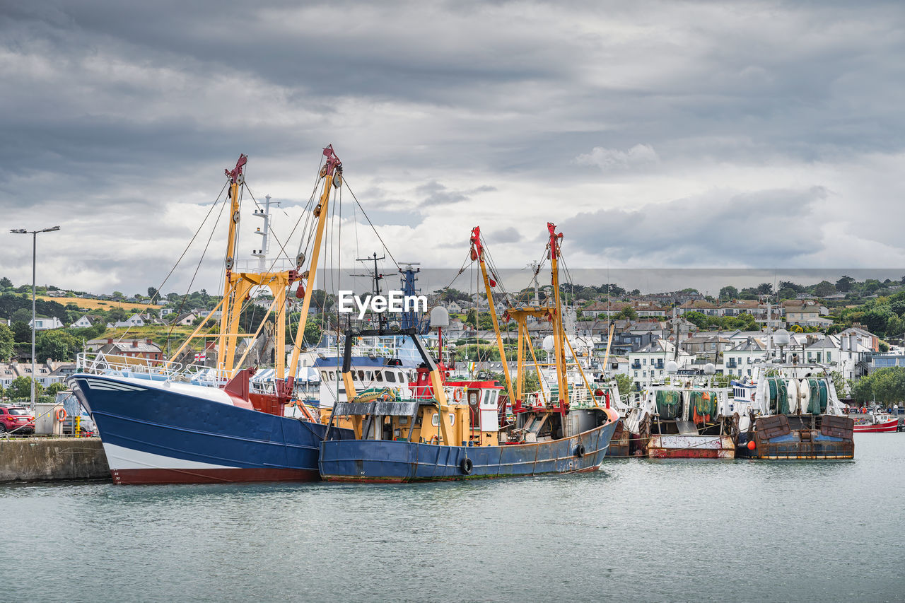 Large fishing boats moored in howth harbour, dublin, ireland