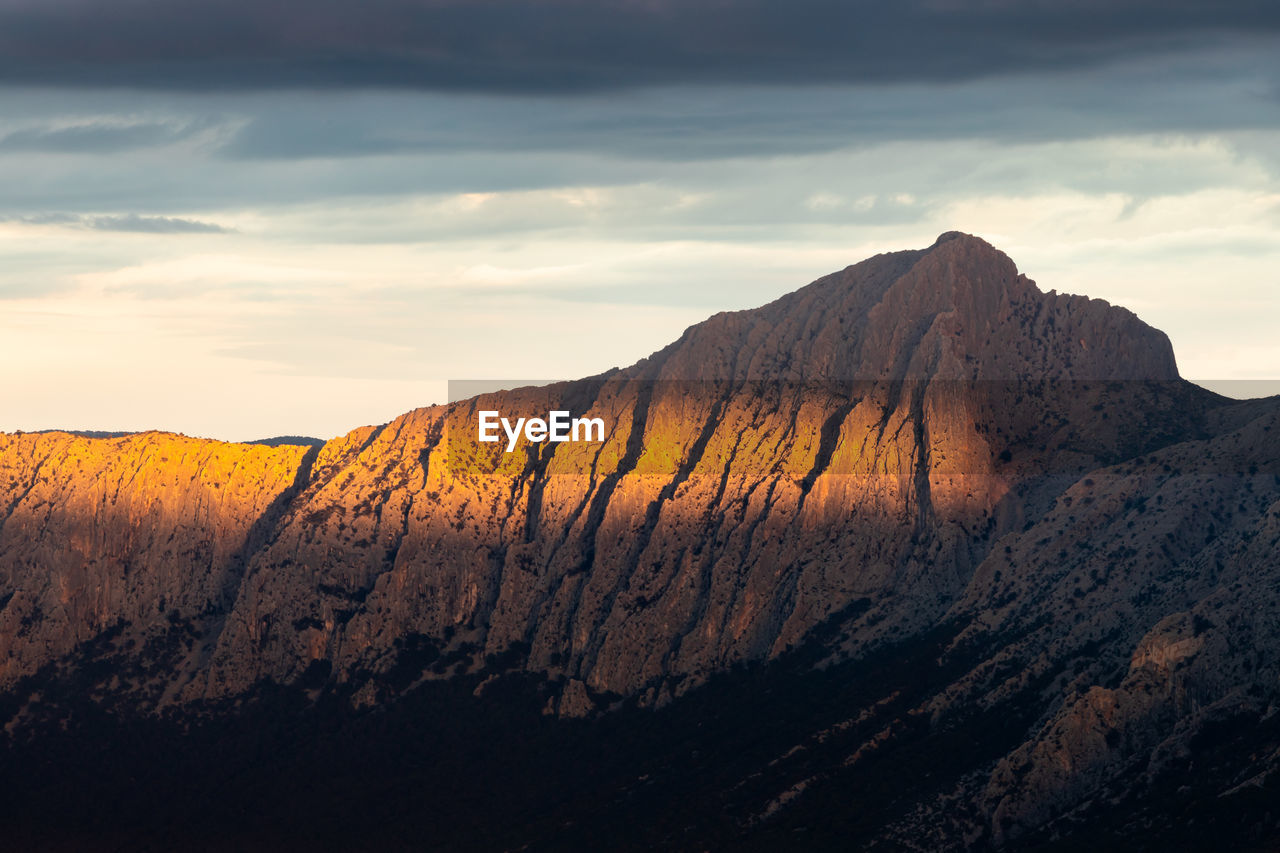 Scenic view of mount corrasi against sky during sunset