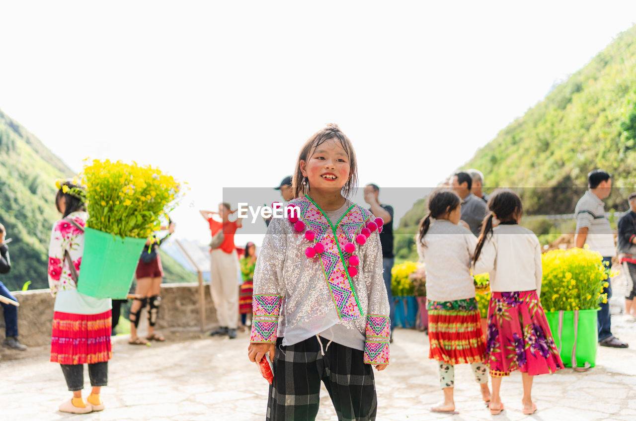 A ethnic minority child in ha giang, vietnam, playing in the sun.