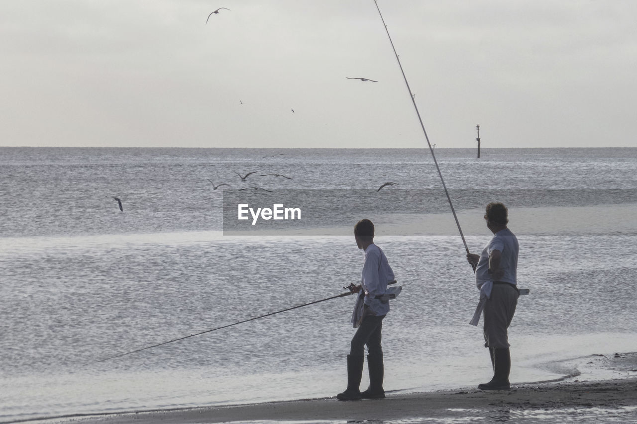 Men fishing at sea