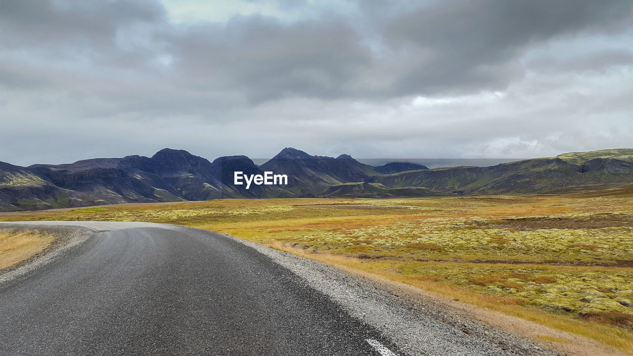 Road amidst landscape against sky