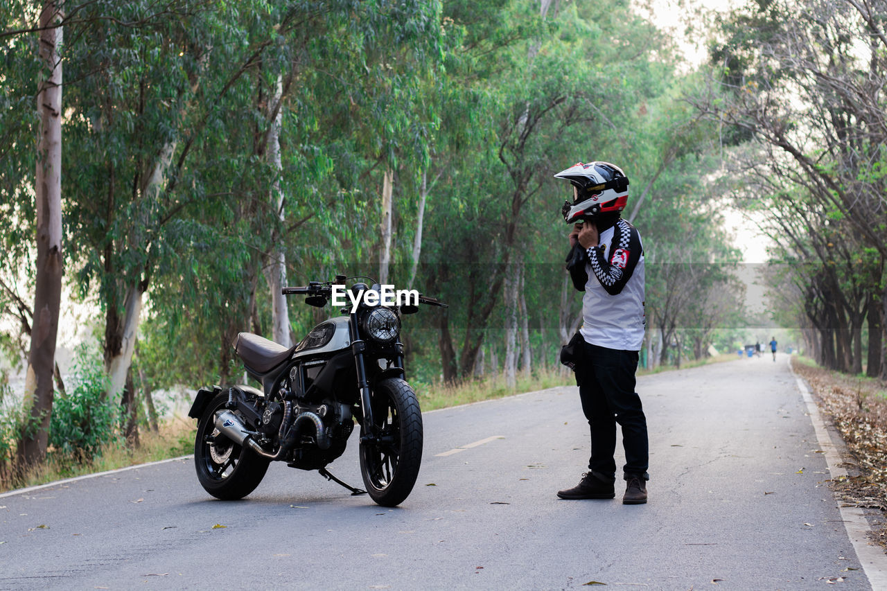 MAN RIDING MOTORCYCLE