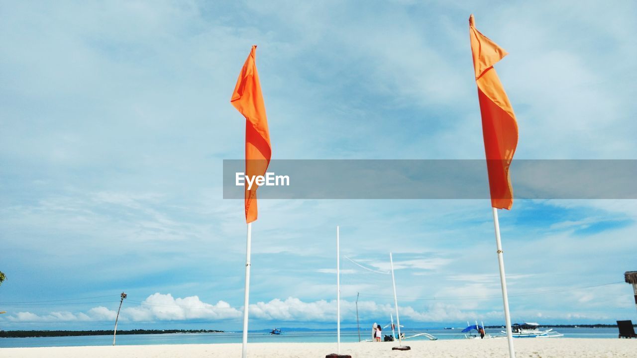 FLAGS ON SEA AGAINST SKY