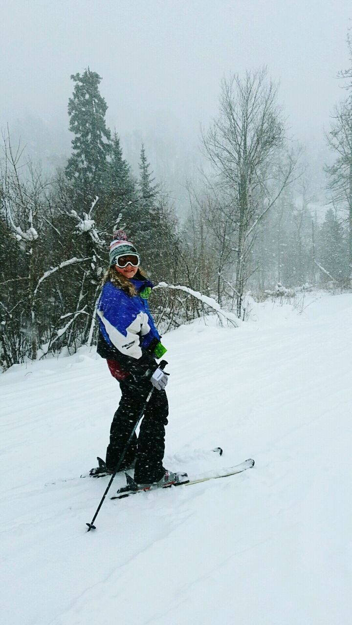 Full length of man on snow covered landscape