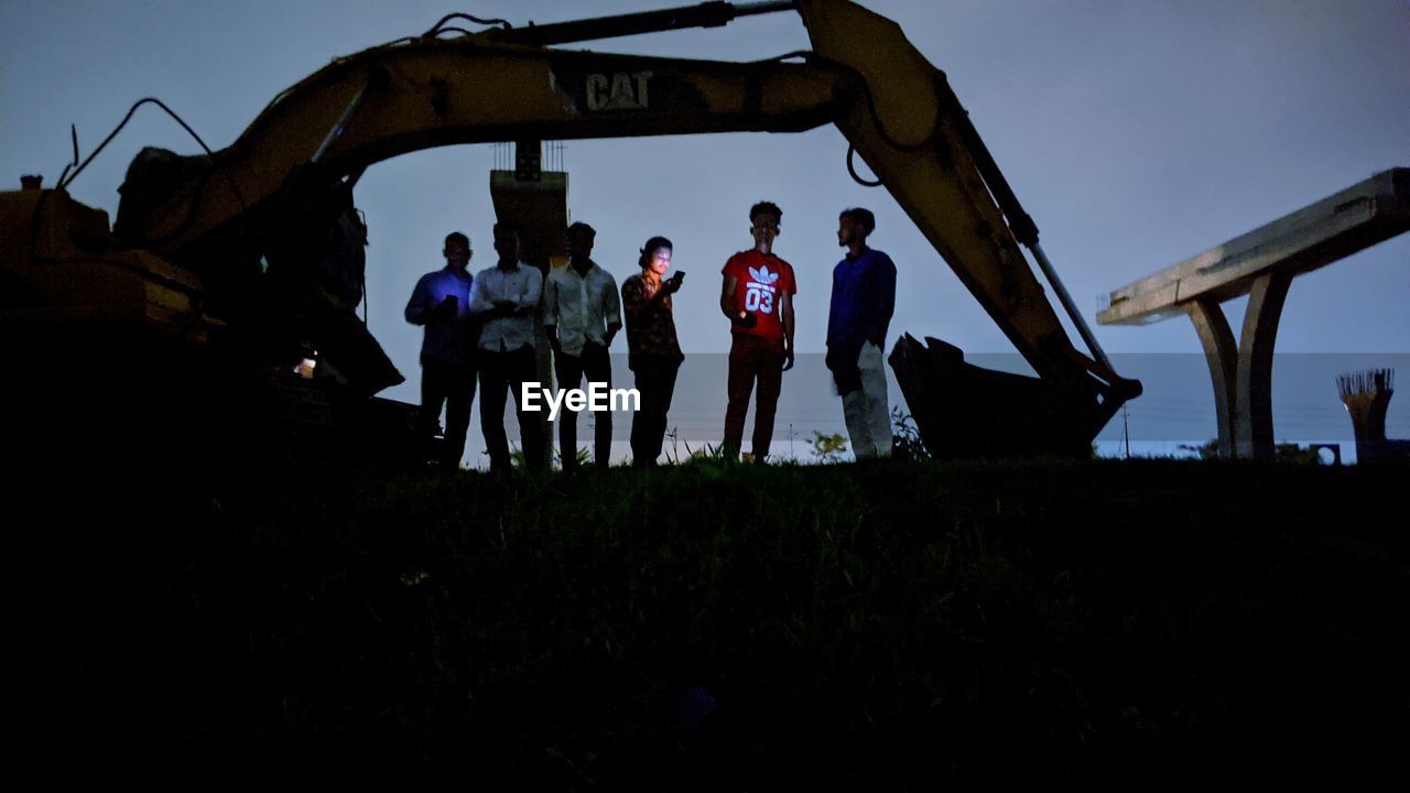 PEOPLE STANDING ON FIELD