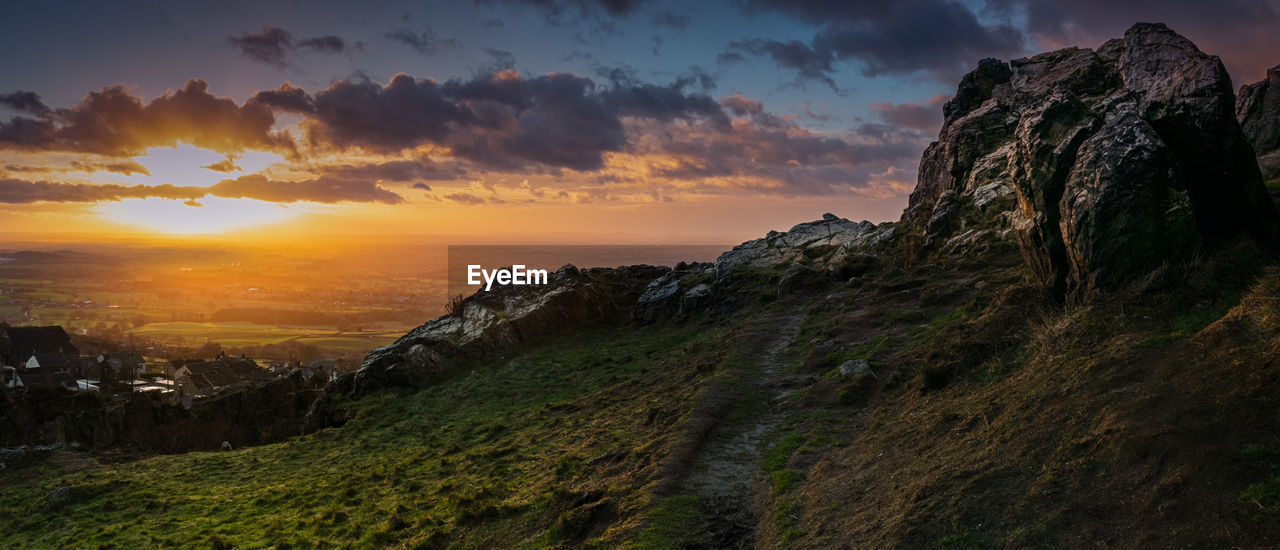 Scenic view of mountains against sky during sunset