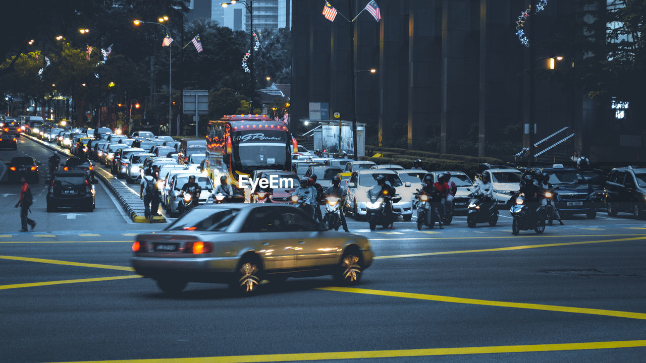 VEHICLES ON ROAD AT NIGHT