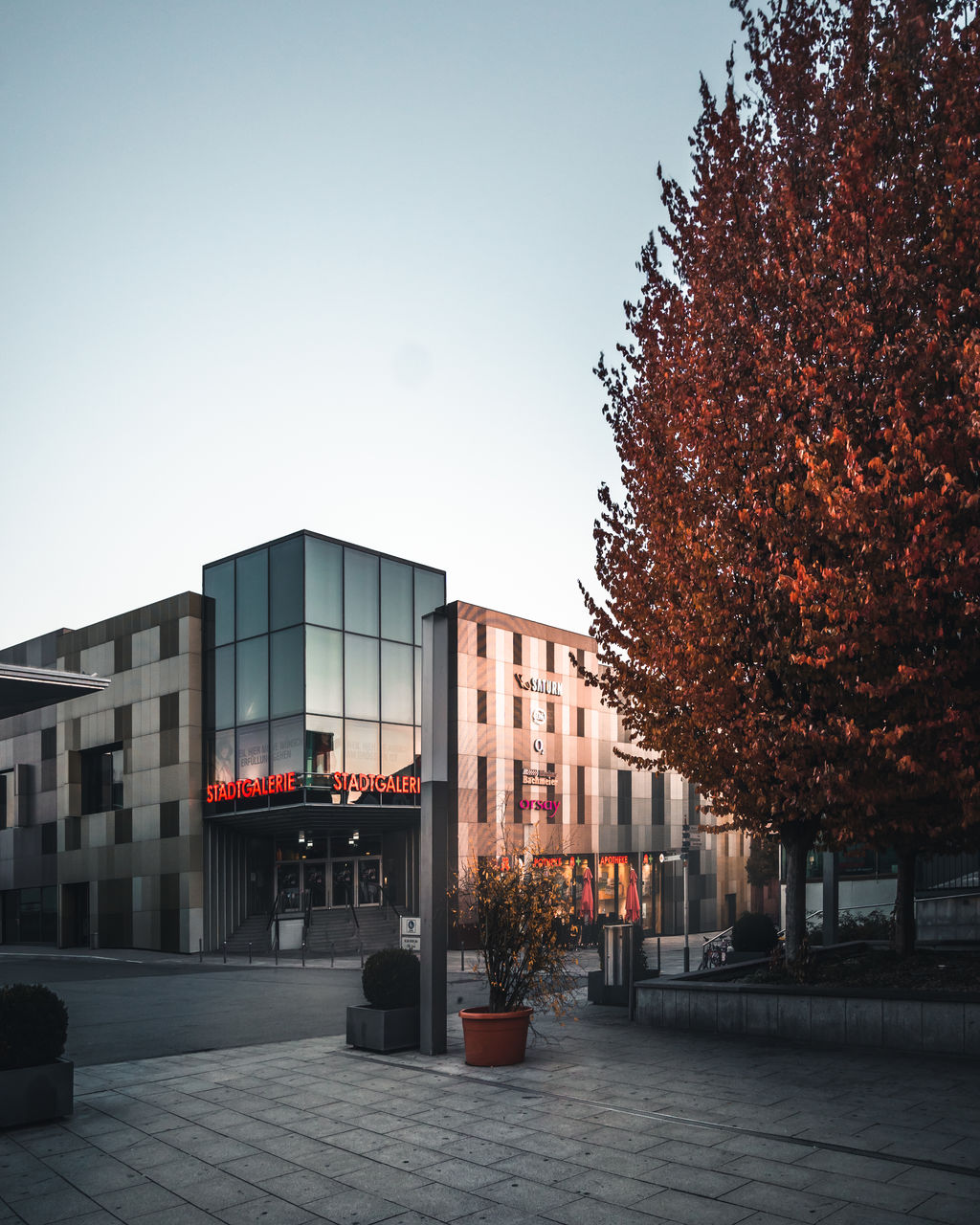 STREET AMIDST BUILDINGS AGAINST SKY