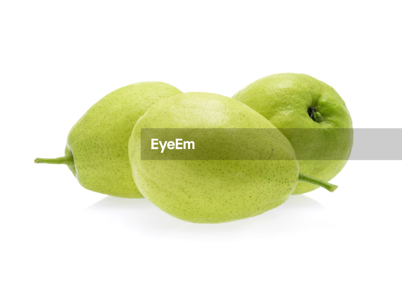 Close-up of fruit against white background