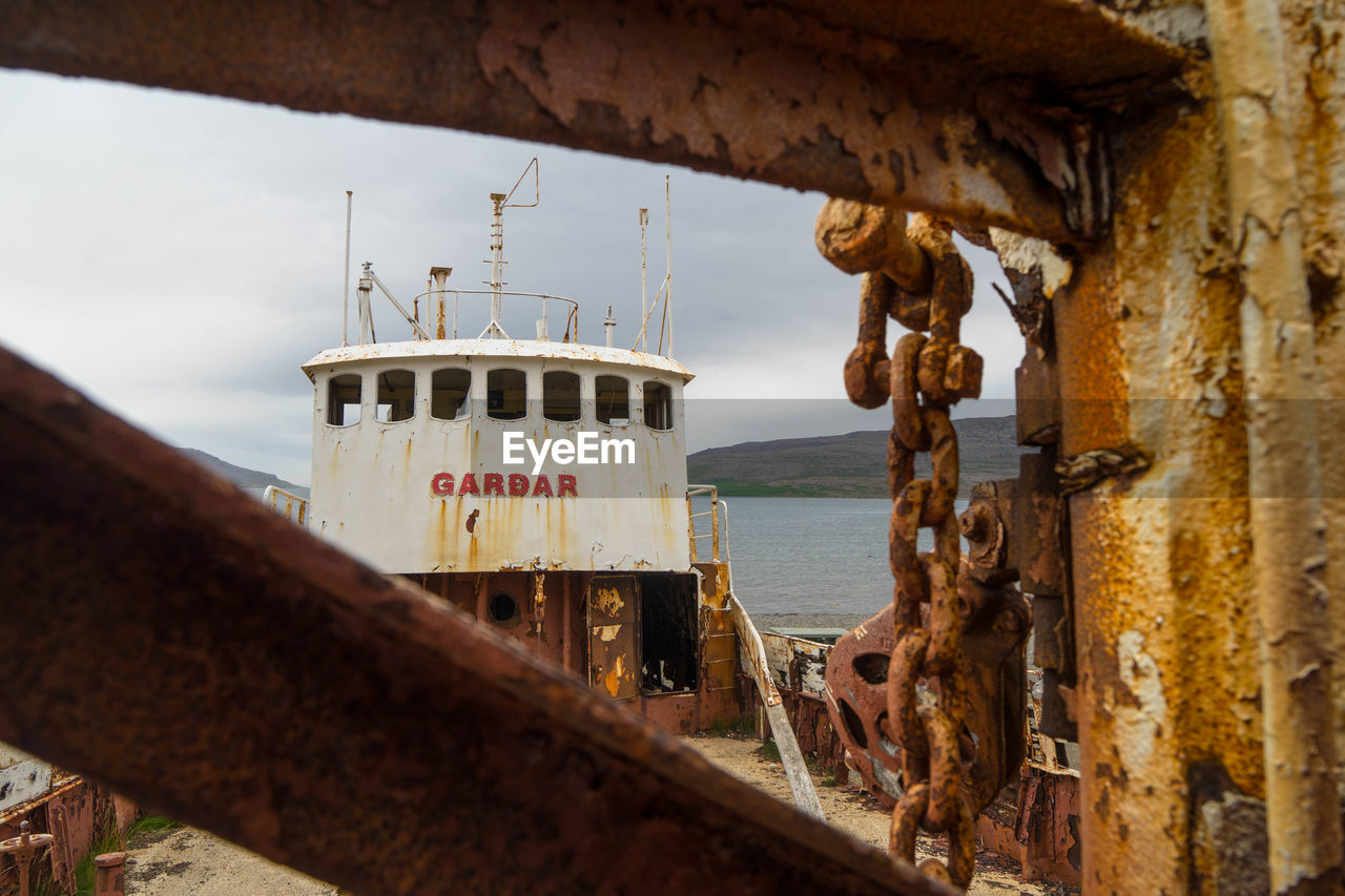 RUSTY SHIP IN SEA