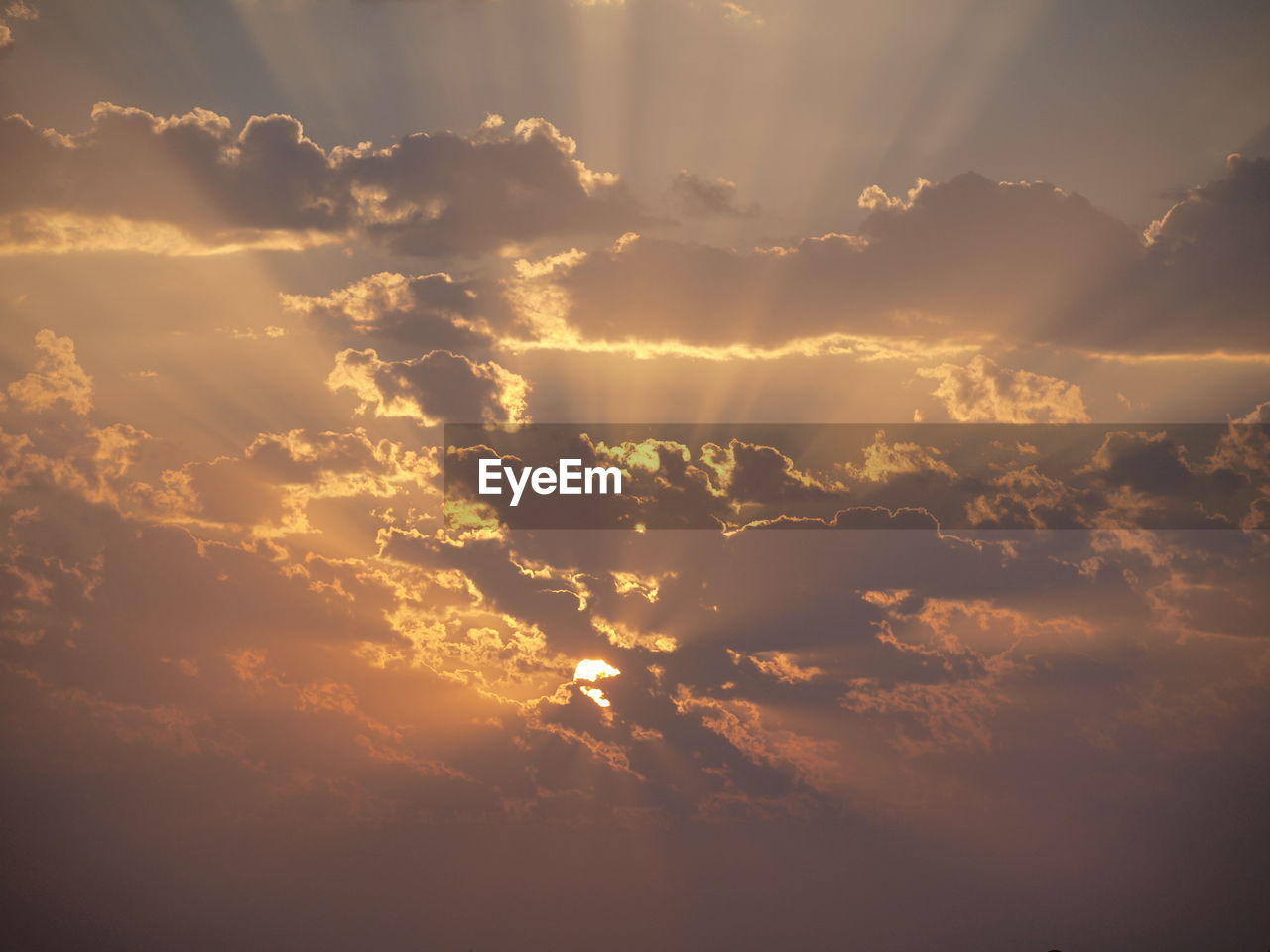 Low angle view of dramatic sky during sunset