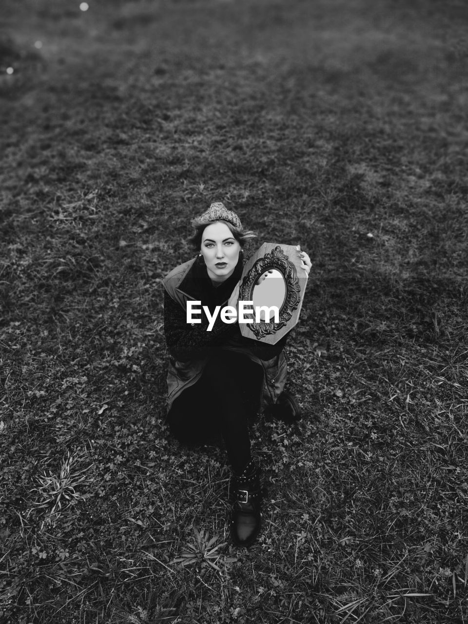 High angle portrait of a young woman on field