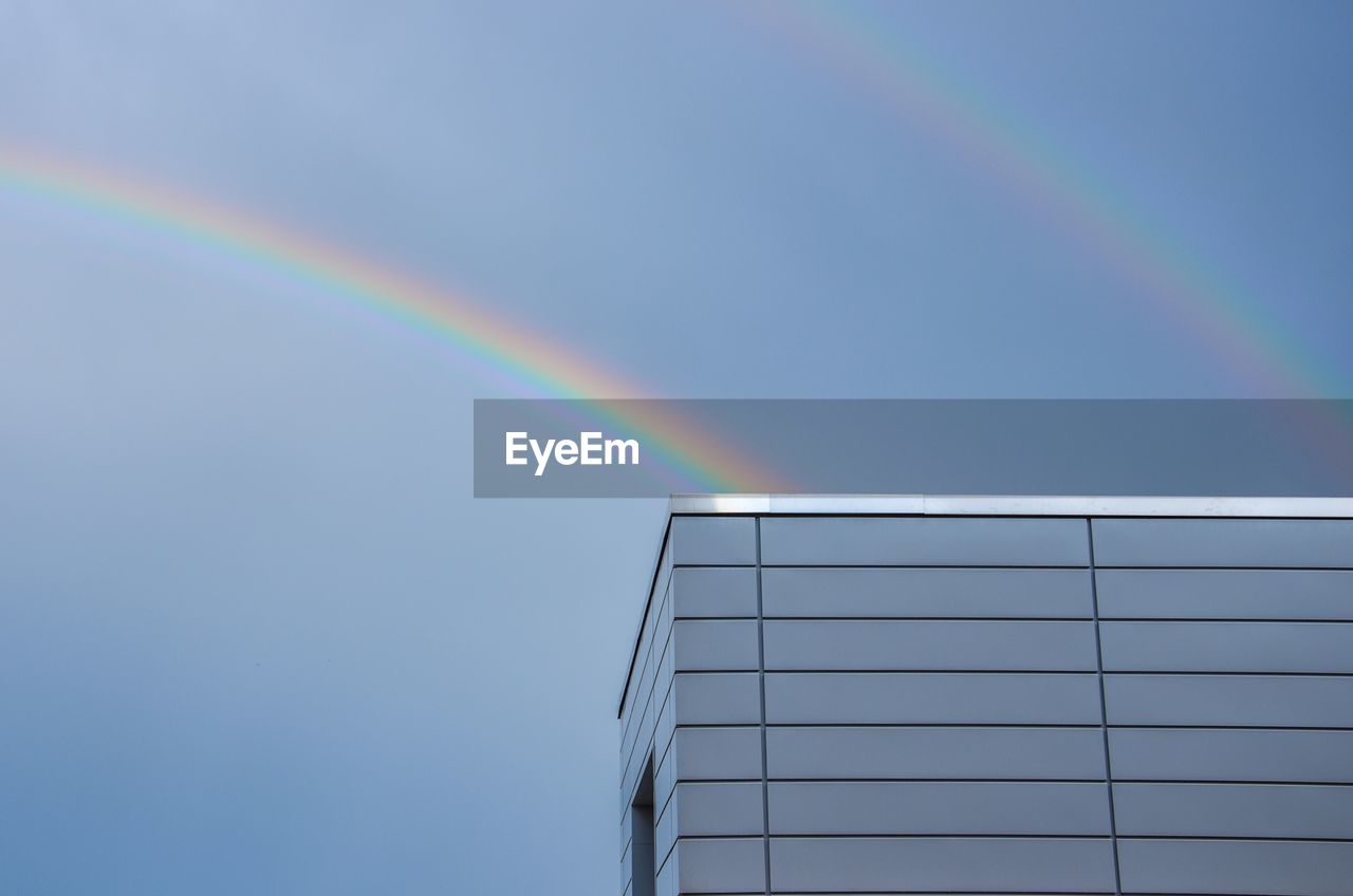 Low angle view of rainbow against sky