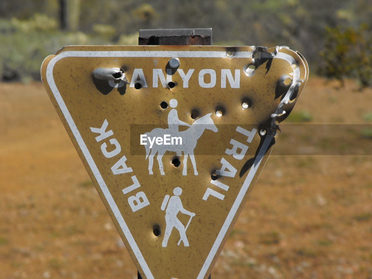 close-up of information sign on field