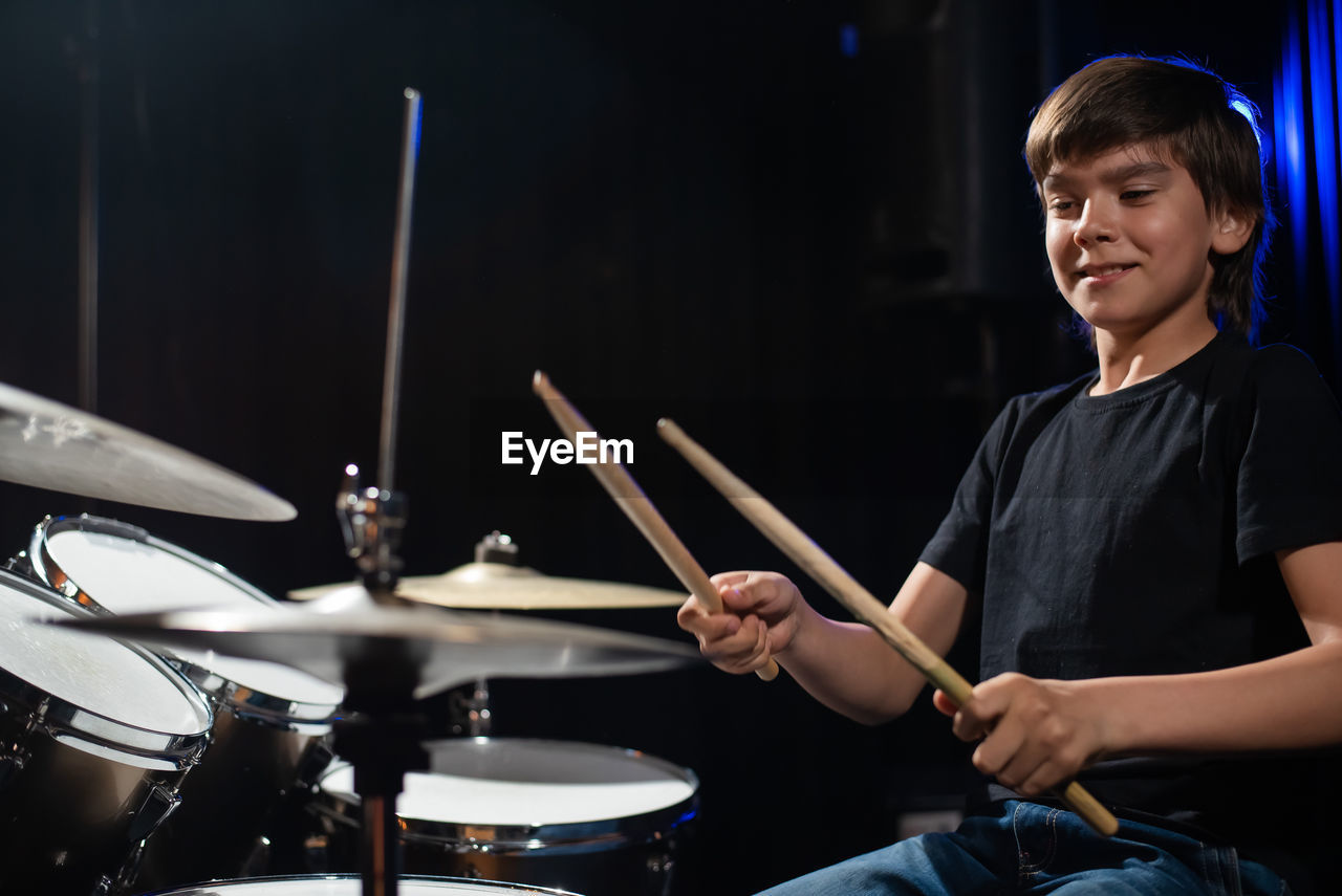 Boy playing drums