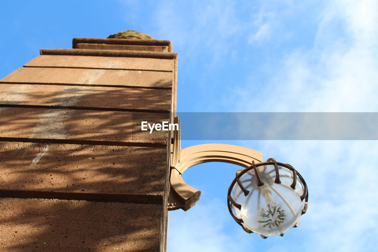 Low angle view of street light against sky