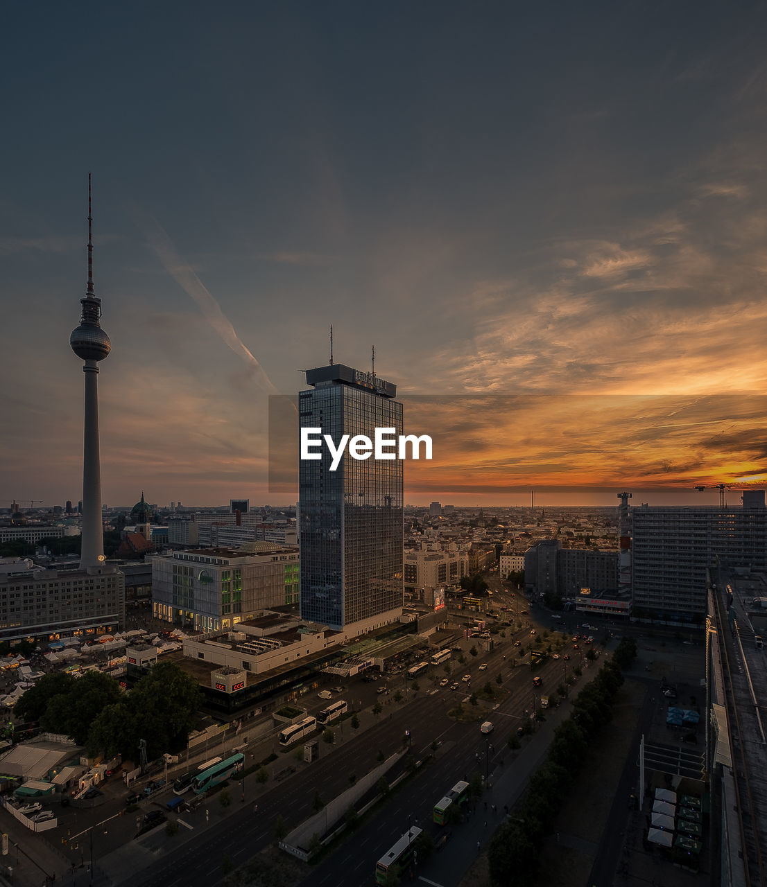 Aerial view of cityscape against sky during sunset