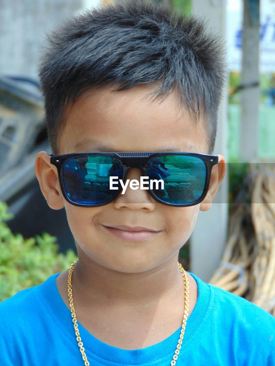 Close-up portrait of boy wearing sunglasses