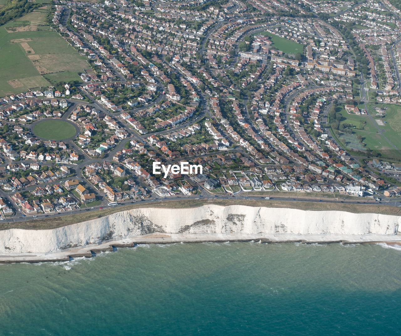 HIGH ANGLE VIEW OF BEACH BY BUILDINGS IN CITY