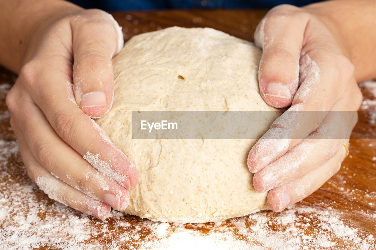 MIDSECTION OF PERSON PREPARING FOOD