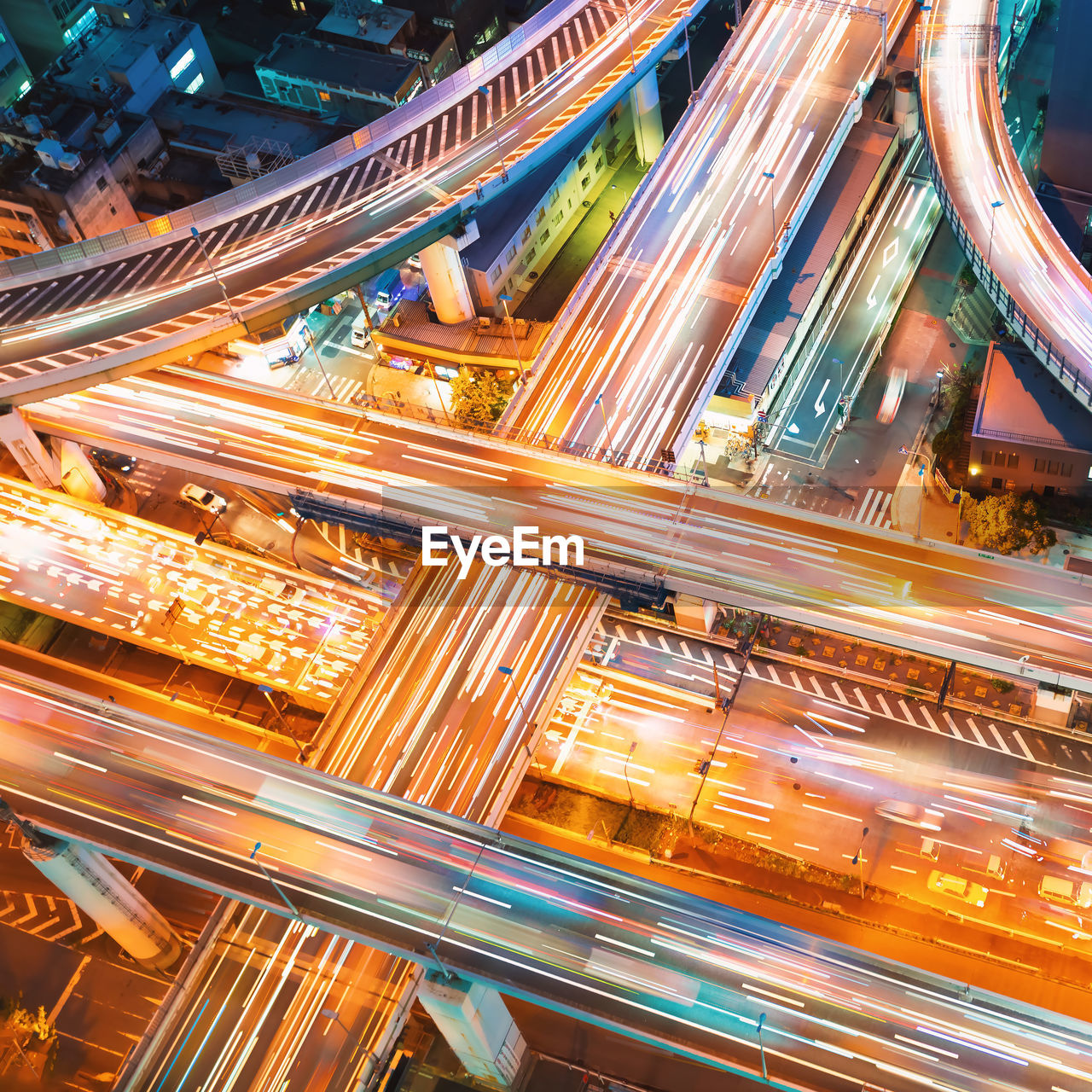 High angle view of light trails on multiple lane highway in city