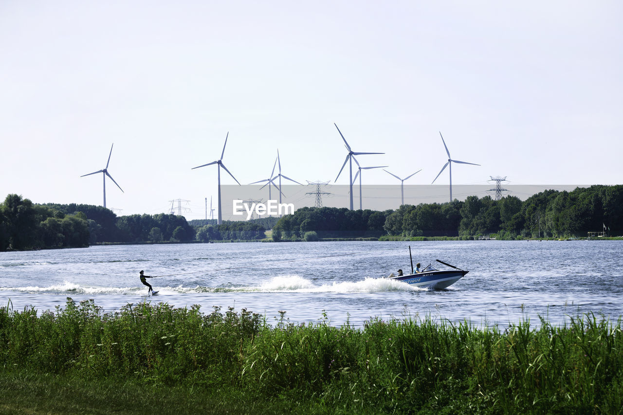 VIEW OF WIND TURBINES ON LAND