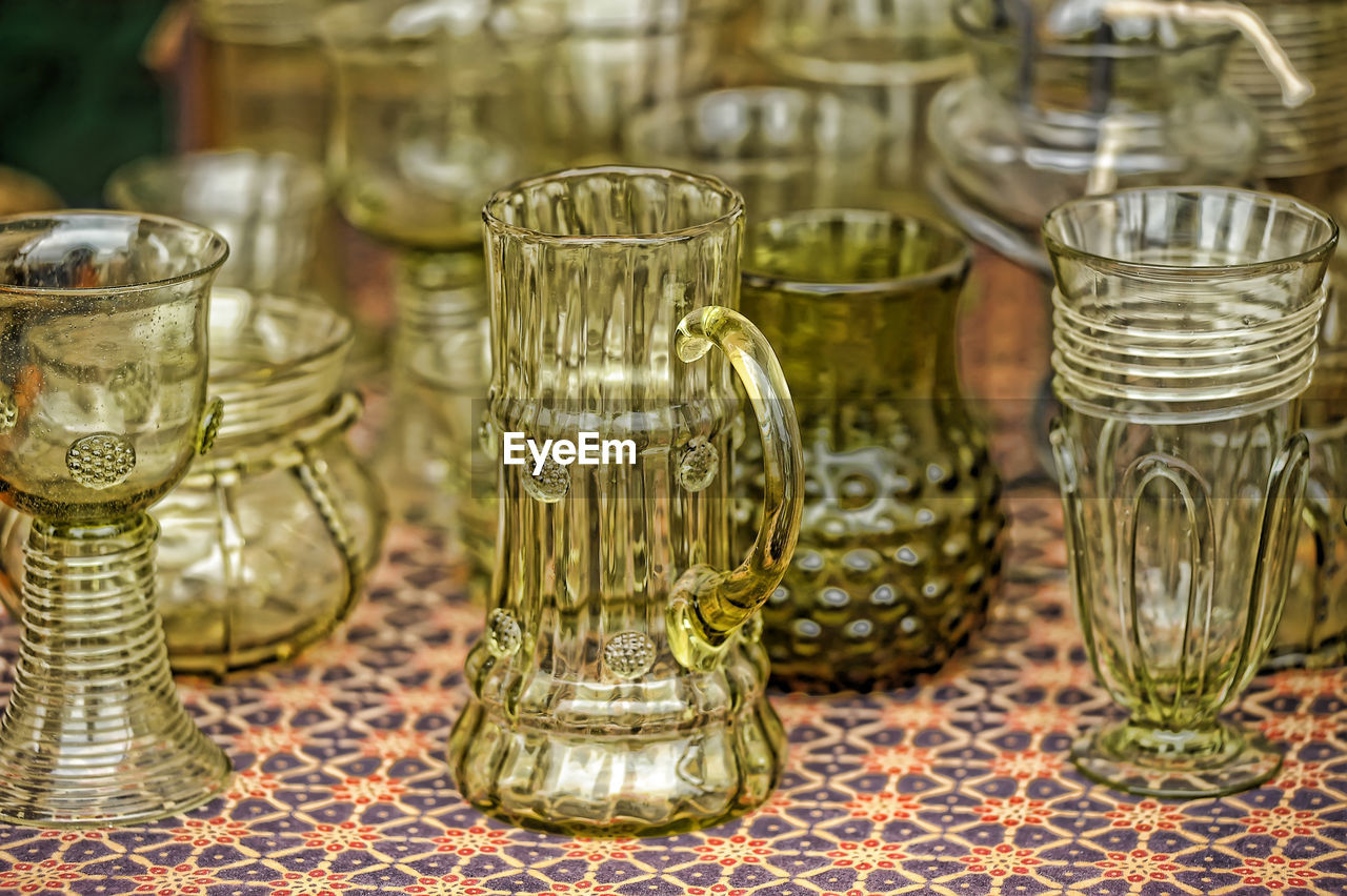 CLOSE-UP OF GLASS JAR ON TABLE AT HOME