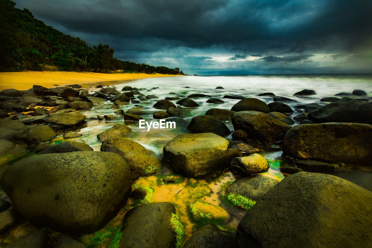 Scenic view of sea against cloudy sky