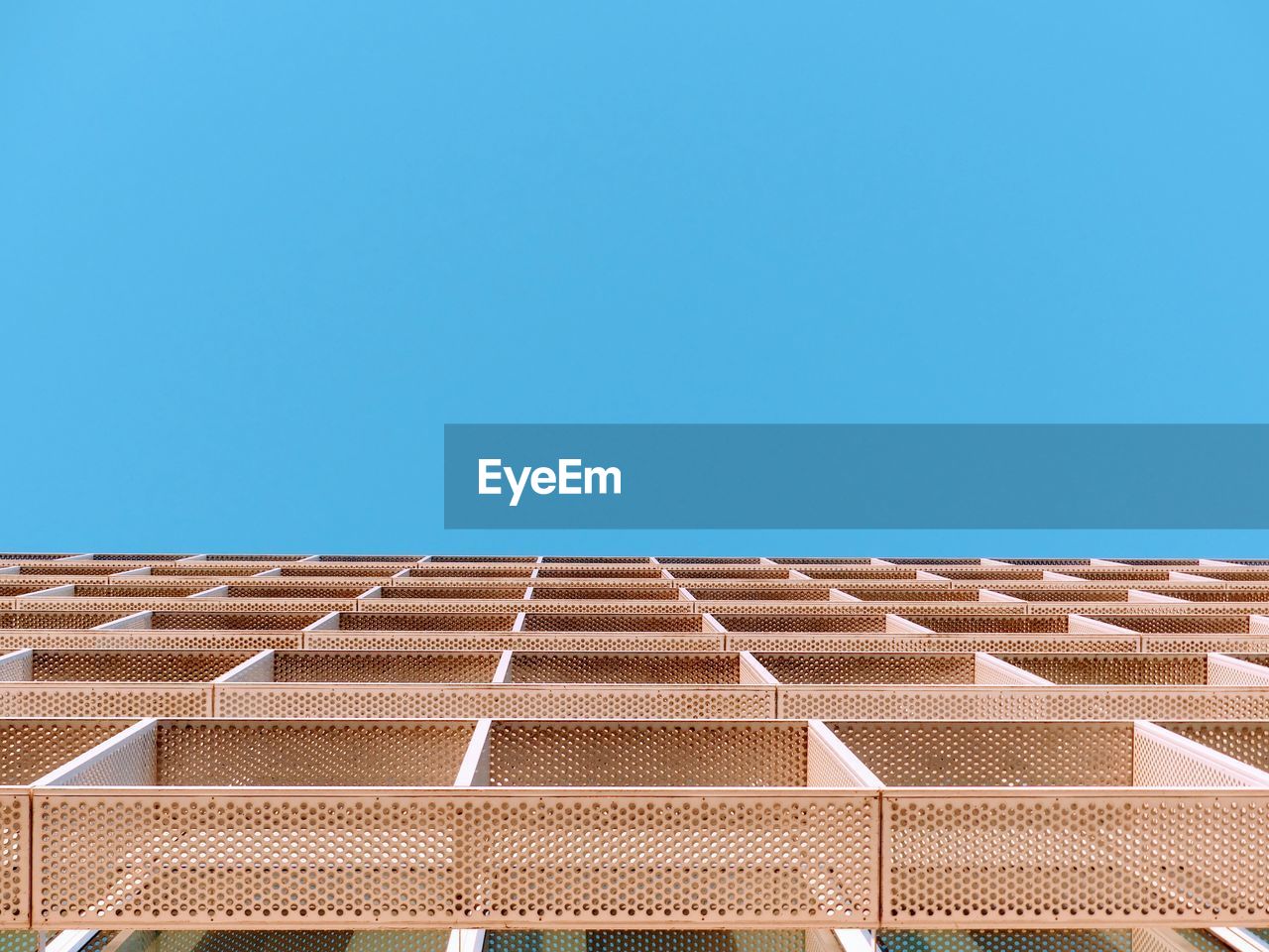 Low angle view of building against clear blue sky