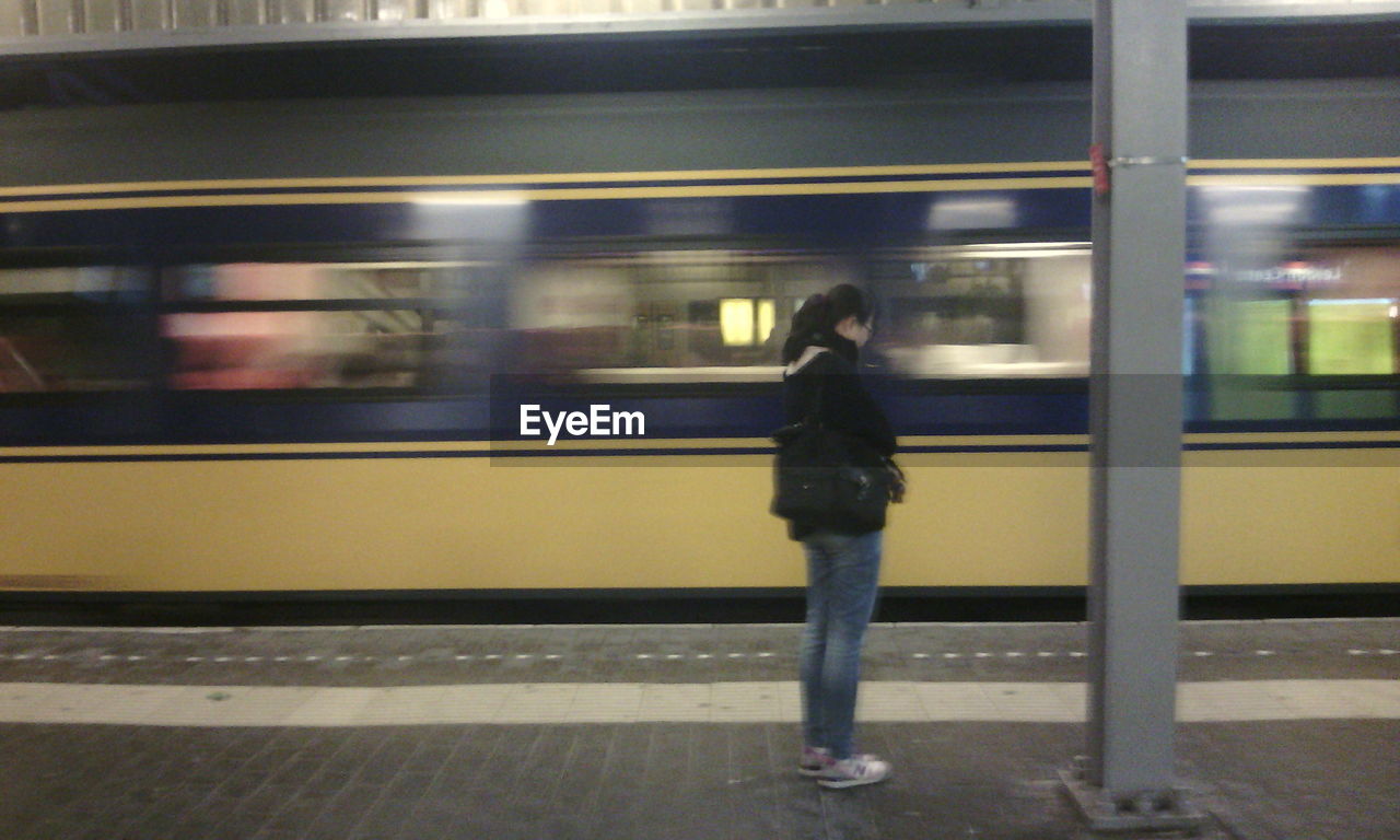 TRAIN AT RAILROAD STATION PLATFORM