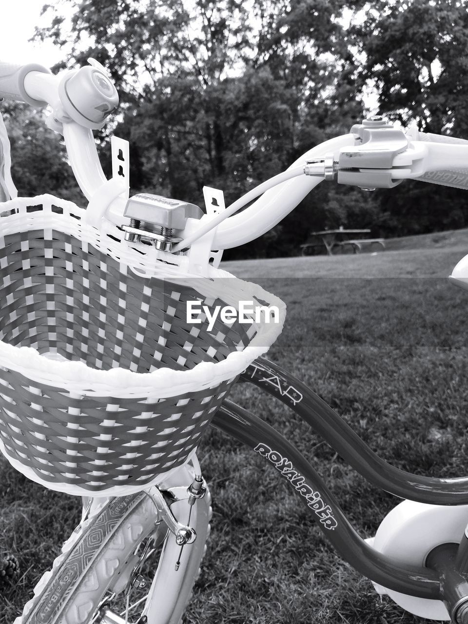 CLOSE-UP OF BICYCLE PARKED AGAINST WALL