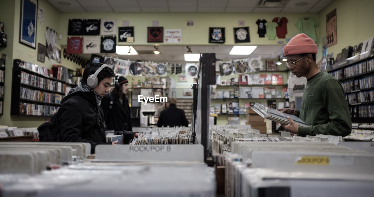 PEOPLE LOOKING AT STORE IN SHOP