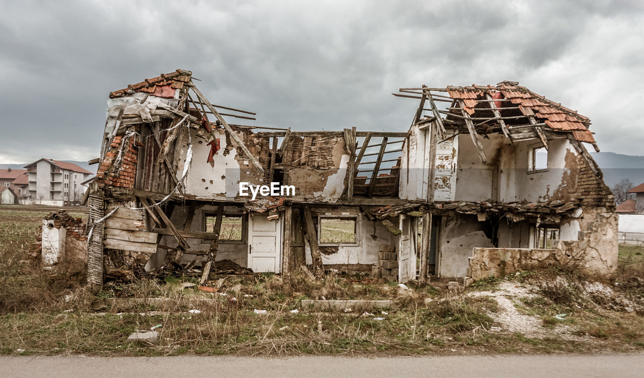 ABANDONED HOUSE AGAINST SKY