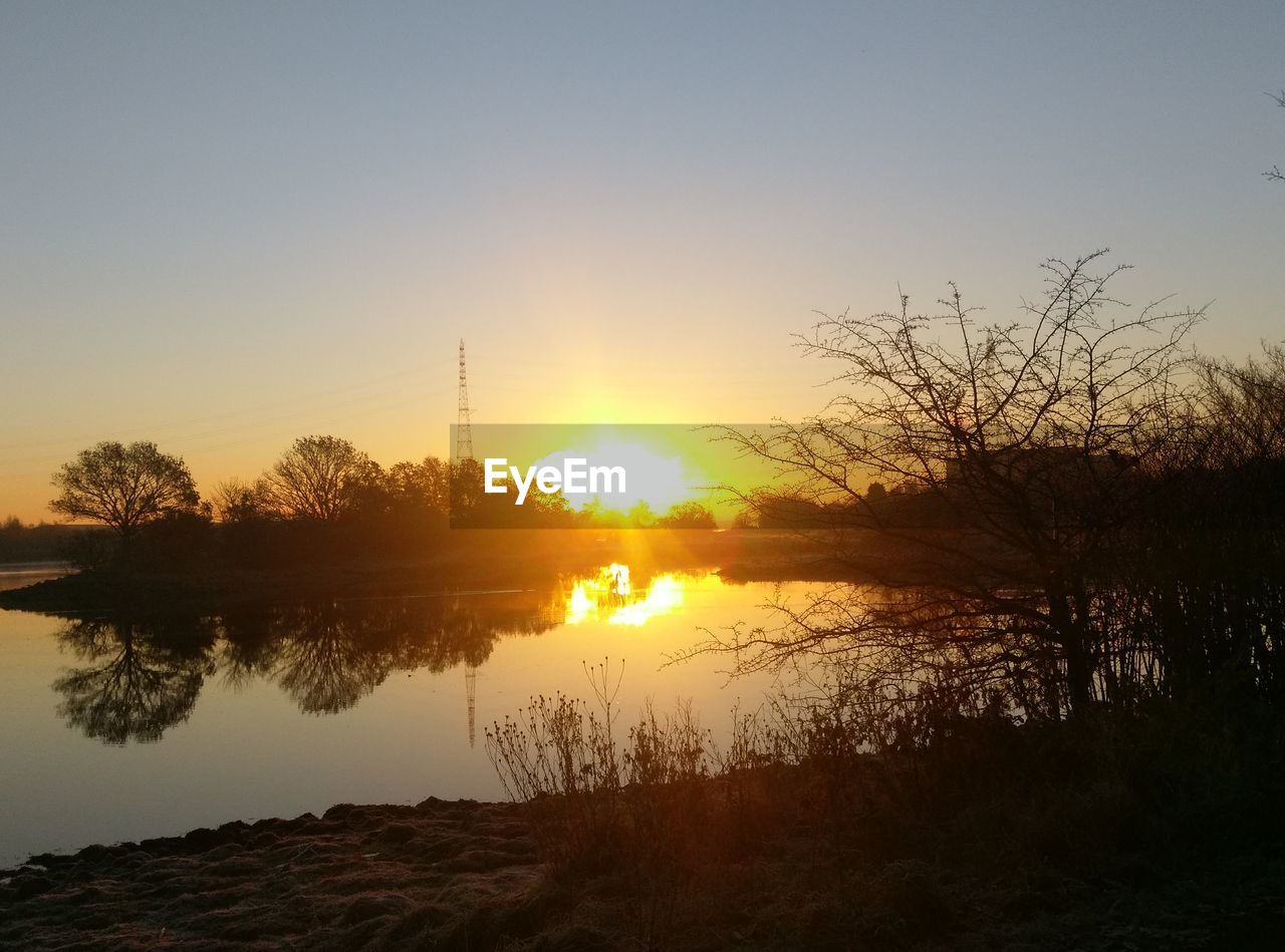 SCENIC VIEW OF SUNSET OVER LANDSCAPE