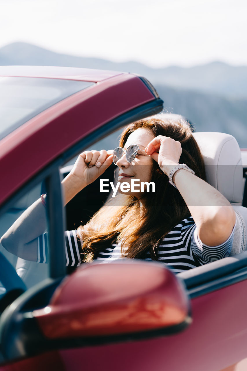 Portrait of woman in car