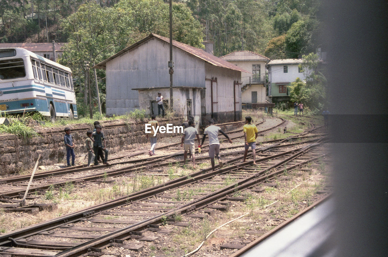 PEOPLE ON RAILROAD TRACKS