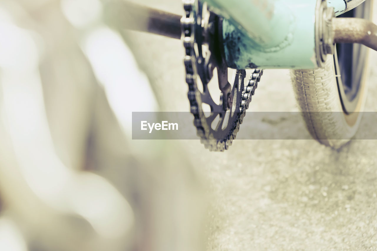 Close-up of bicycle wheel on road