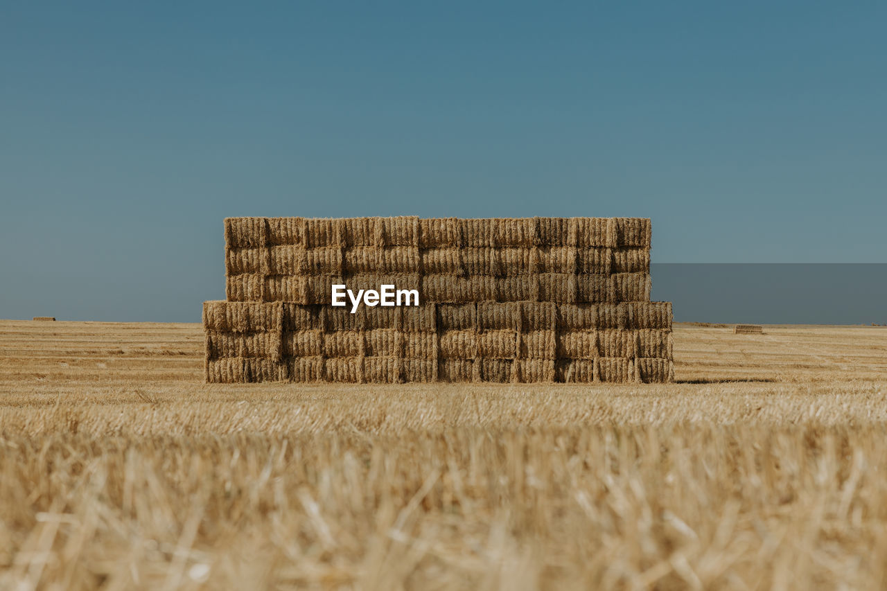 Large pile of hay bales