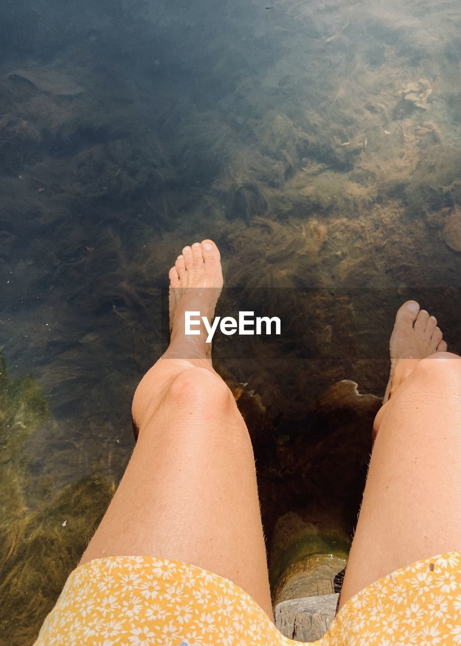human leg, low section, water, personal perspective, one person, adult, nature, barefoot, lifestyles, limb, human limb, leisure activity, human foot, high angle view, relaxation, women, vacation, trip, holiday, day, beach, sea, land, sand, hand, outdoors, sunlight, summer, shoe